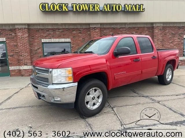 2013 Chevrolet Silverado  Silverado in front of used car dealership