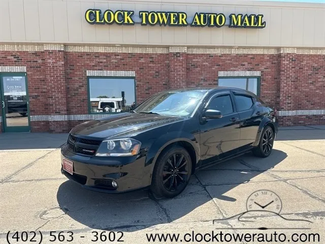 2013 Dodge Avenger  Avenger in front of used car dealership