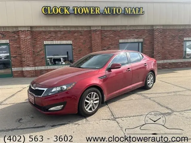 2013 Kia Optima  Optima in front of used car dealership