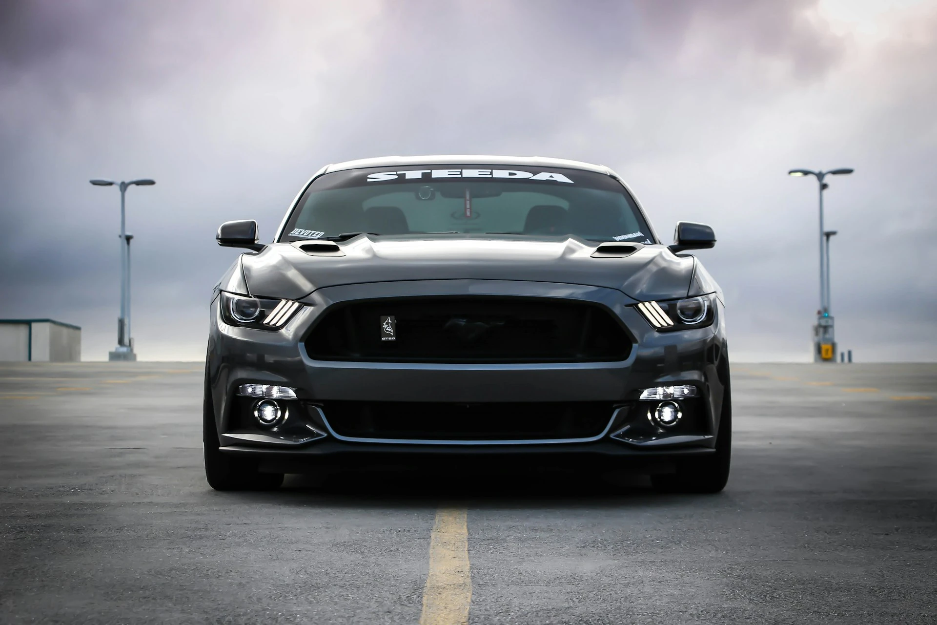 Black 2023 Ford mustang on display at Clock Tower Auto Sales
